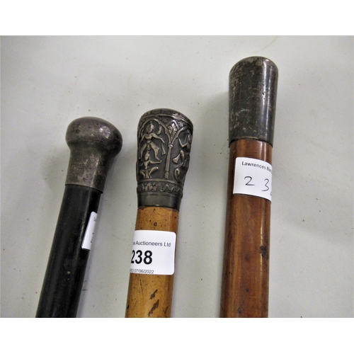 238 - Anglo Indian white metal mounted Malacca walking cane, together with two other similar silver mounte... 