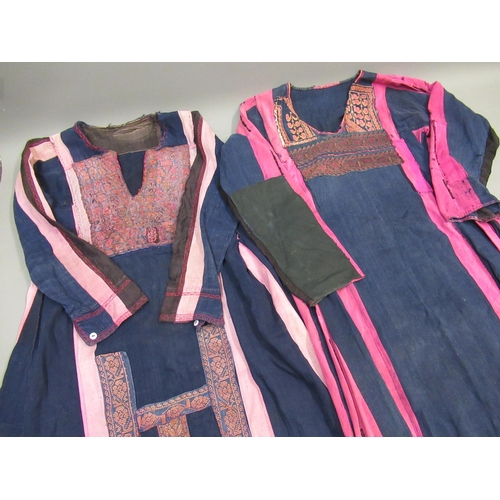 37 - Two Palestinian dresses, each later applied with antique woolwork panels