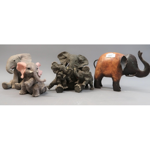 657 - Porcelain model of a seated baby elephant and three other figures of elephants