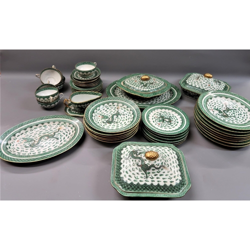 667 - 20th Century Chinese dinner service decorated with green dragons within a green hatched border on a ... 