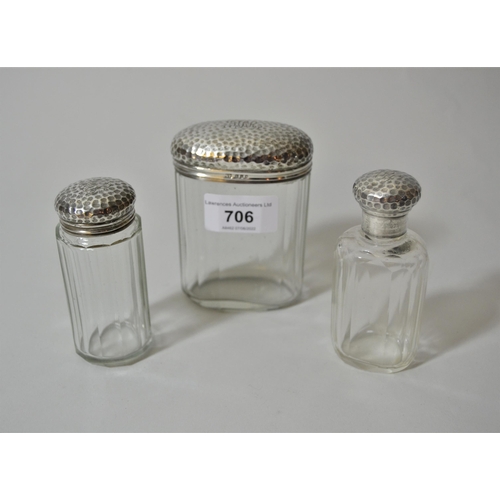 706 - Set of three London silver cut glass dressing table bottles