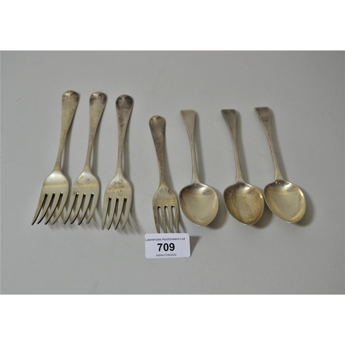 709 - Group of four George III silver table forks, pair of Victorian silver dessert spoons and a quantity ... 