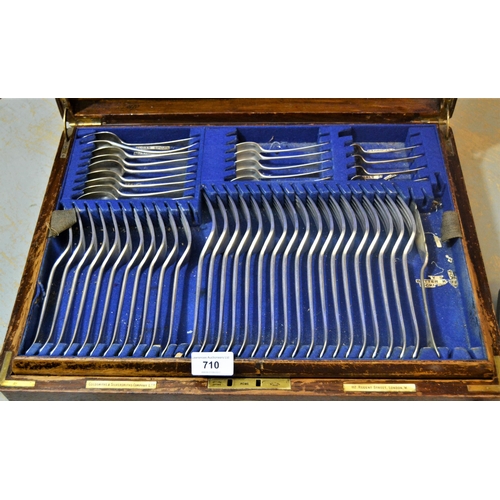 710 - Goldsmiths & Silversmiths Company, oak cased canteen of silver plated Old English pattern cutlery (i... 