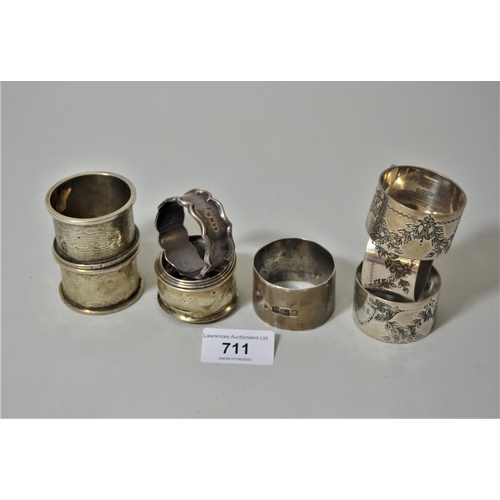 711 - Five various silver napkin rings and three plated napkin rings