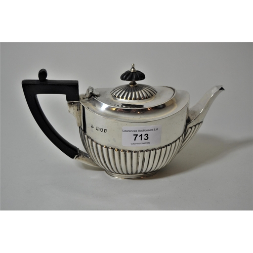 713 - Small London silver bachelor's teapot, with half gadroon decoration and ebonised handle, 7.5 troy oz... 