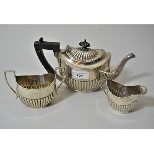 721 - Sheffield silver three piece bachelor's teaset of oval form with half gadroon decoration, makers mar... 