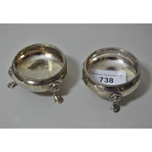 738 - Pair of early 19th Century London silver circular salts on low hoof supports