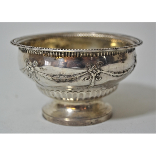 745 - George III London silver circular pedestal bowl having embossed swag and half gadroon decoration