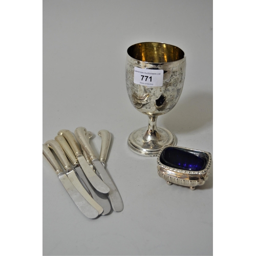 771 - Silver trophy cup (at fault), silver salt with blue glass liner and seven silver handled tea knives