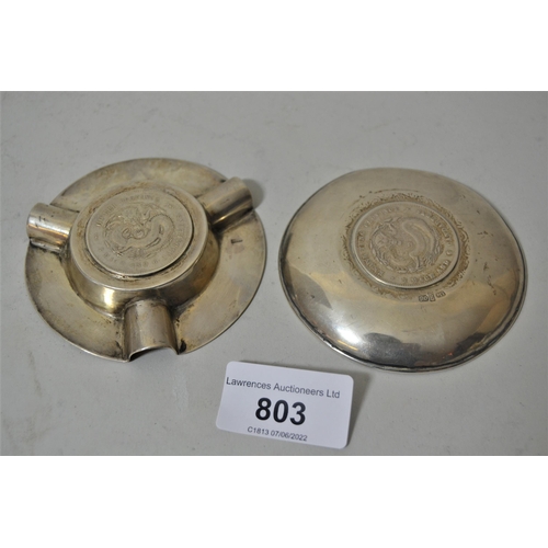 803 - Two Chinese silver coin inset ashtrays