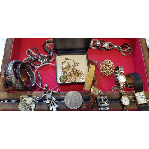 854 - Reproduction studwork jewel casket containing a small quantity of miscellaneous costume jewellery an... 