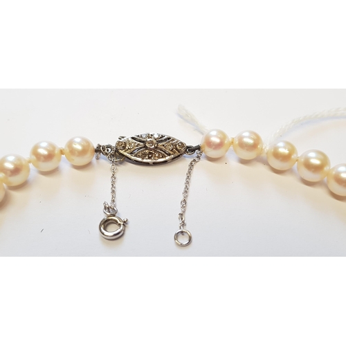 871 - Single row graduated cultured pearl necklace with white gold diamond set clasp