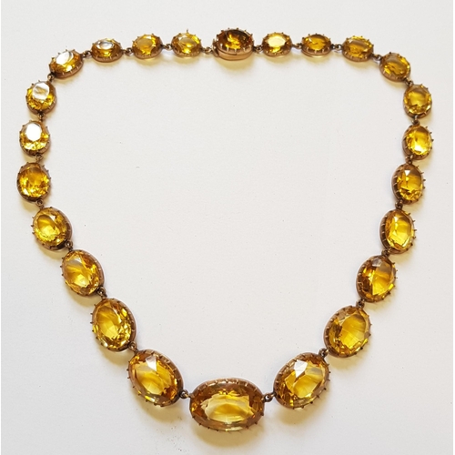 941 - 19th Century oval gold mounted citrine riviere necklet set 24 graduated stones, the largest approxim... 