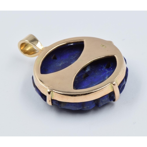 969 - Circular 14ct gold carved lapis lazuli pendant