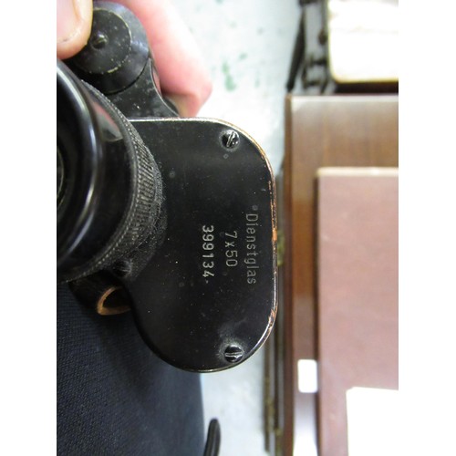 104 - Pair of World War II German Dienstglas 7 x 50 binoculars, inscribed B.E.H.