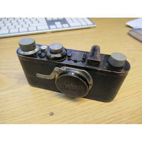 202 - Early Leica I 35mm camera, Serial No. 225, with a Leitz Anastigmat 50mm lens, with original brown le... 