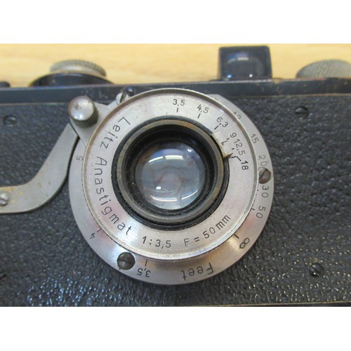 202 - Early Leica I 35mm camera, Serial No. 225, with a Leitz Anastigmat 50mm lens, with original brown le... 