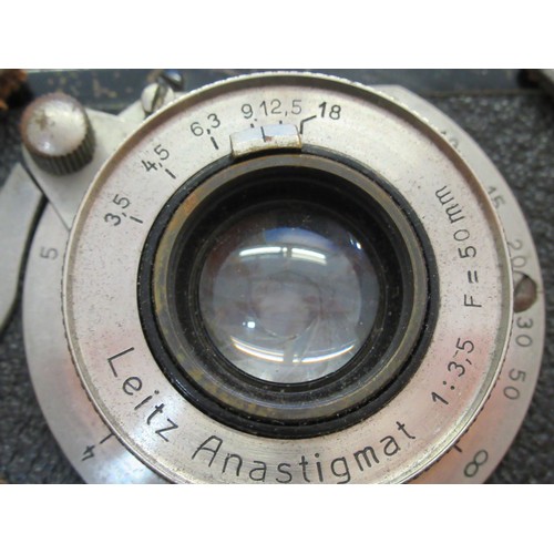 202 - Early Leica I 35mm camera, Serial No. 225, with a Leitz Anastigmat 50mm lens, with original brown le... 