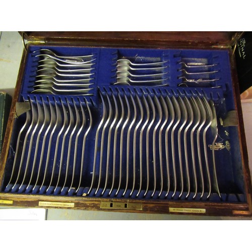 710 - Goldsmiths & Silversmiths Company, oak cased canteen of silver plated Old English pattern cutlery (i... 