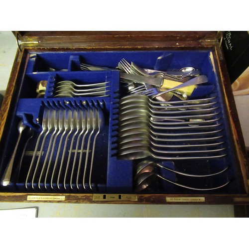 710 - Goldsmiths & Silversmiths Company, oak cased canteen of silver plated Old English pattern cutlery (i... 