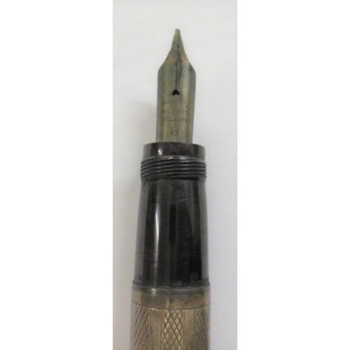 252 - Large silver cased travel fountain pen with engine turned decoration, makers mark rubbed, inscribed ... 