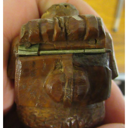 79 - Carved coquilla nut snuff box in the form of a figure wearing waistcoat and tails, 2.5ins wide