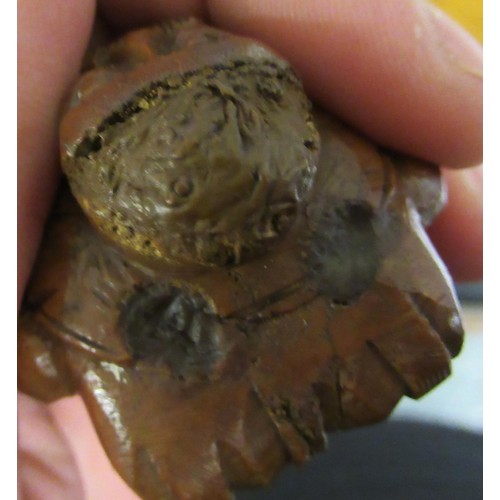 79 - Carved coquilla nut snuff box in the form of a figure wearing waistcoat and tails, 2.5ins wide