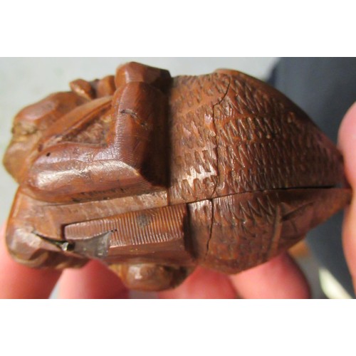 79 - Carved coquilla nut snuff box in the form of a figure wearing waistcoat and tails, 2.5ins wide