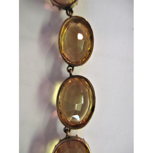 941 - 19th Century oval gold mounted citrine riviere necklet set 24 graduated stones, the largest approxim... 