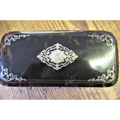 766 - Tortoiseshell and silver pique work rectangular trinket box with hinged cover, 5.25ins wide