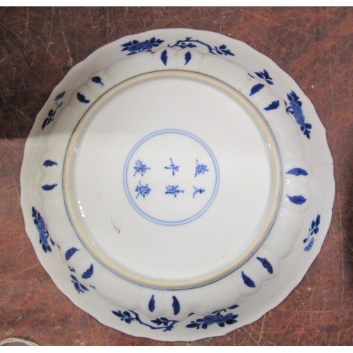 444 - 18th Century Chinese blue and white plate painted with flowers, six character mark within dual conce... 