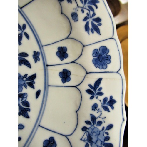 444 - 18th Century Chinese blue and white plate painted with flowers, six character mark within dual conce... 