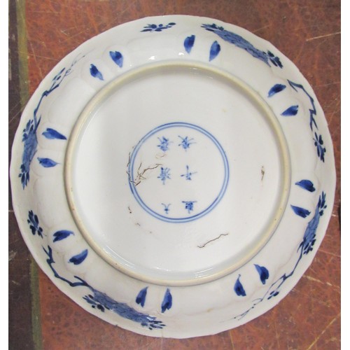 444 - 18th Century Chinese blue and white plate painted with flowers, six character mark within dual conce... 