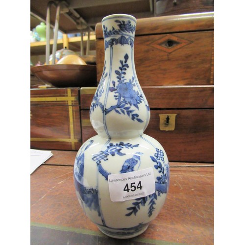 454 - Small Chinese porcelain gourd shaped vase painted with figures and flowering trees in blue and white... 