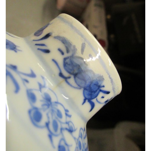 454 - Small Chinese porcelain gourd shaped vase painted with figures and flowering trees in blue and white... 