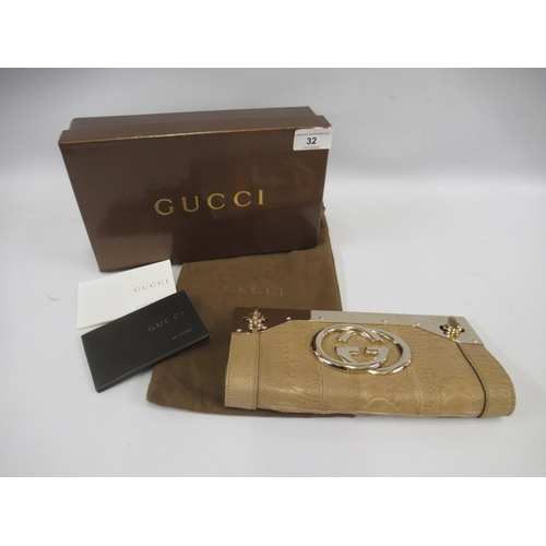 32 - Gucci beige leather Britt clutch bag with gold tone hardware, complete with dust bag, box and papers