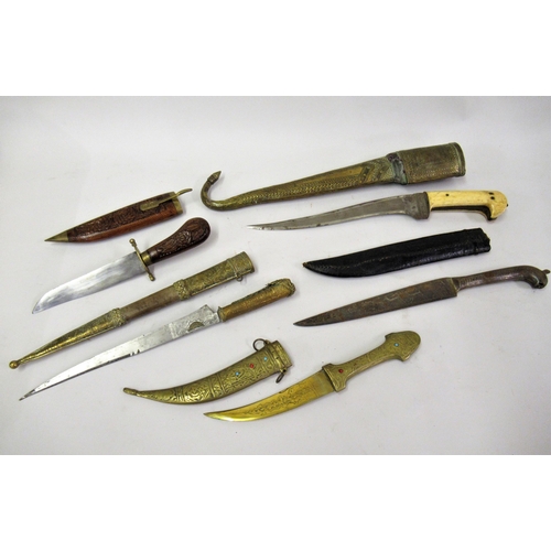 124 - Group of five various Middle Eastern and oriental daggers