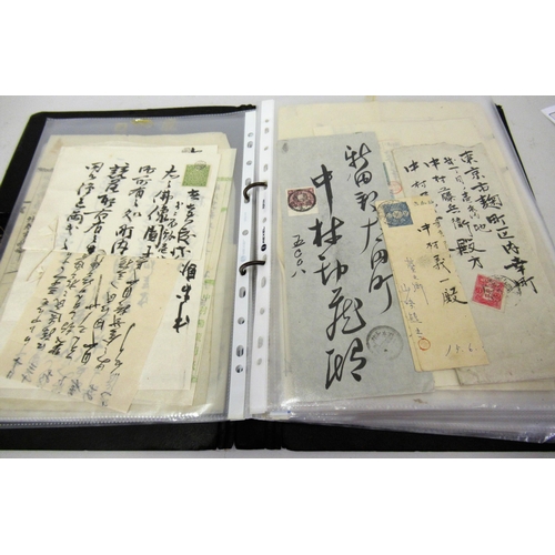 143 - Album containing a collection of Japanese revenue stamps