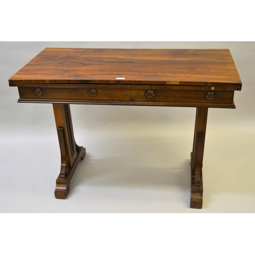 1808 - William IV rectangular rosewood card table, the fold-over top above a moulded frieze with applied pa... 