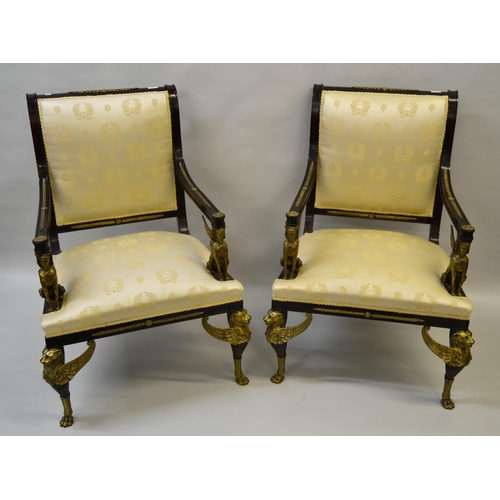 1819 - Pair of 19th Century mahogany and gilt brass mounted open armchairs in French Empire style, the ivor... 