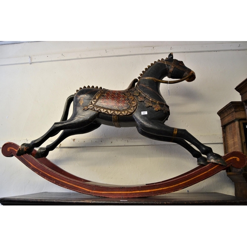 1821 - 20th Century Tibetan carved and painted rocking horse, 41ins x 63ins approximately