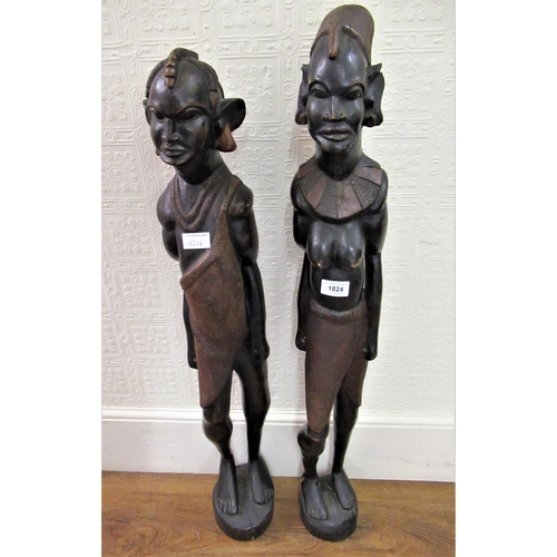 1824 - Pair of 20th Century African native carved hardwood standing figures, 35ins high approximately