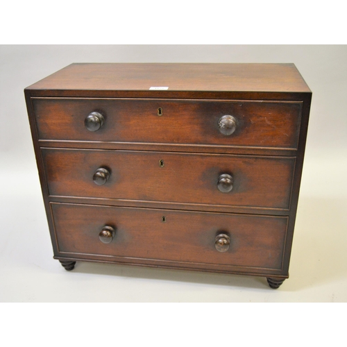 1825 - Small 19th Century mahogany table chest, the flush top above three graduated drawers with knob handl... 