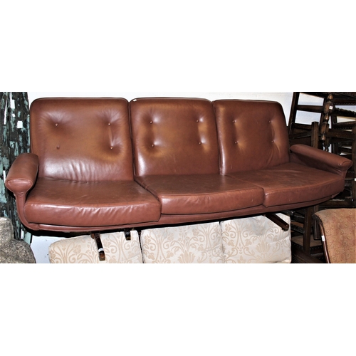 1826 - Mid to late 20th Century tan leather upholstered three seat sofa on stylised supports, 84ins wide ap... 