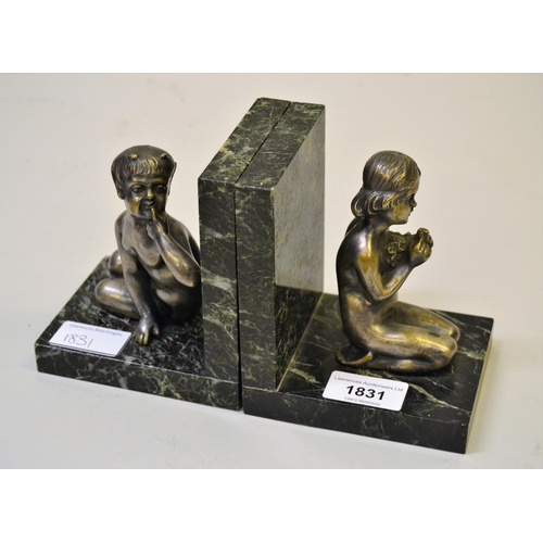 1831 - Henry Fugere, pair of silvered bronze and marble bookends in the form of a seated faun and kneeling ... 