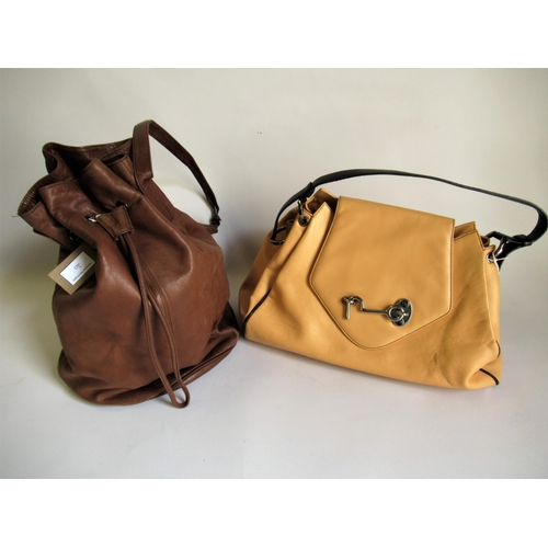 20 - Tanner Krolle, large tan leather shoulder bag with black trim and hook and loop fastening, together ... 