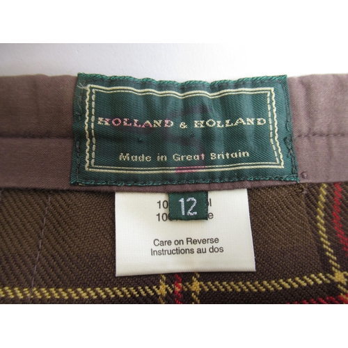 22 - Holland & Holland, London, long plain brown kilt and a short tartan kilt, both size 12 and a Holland... 