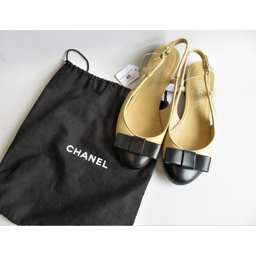 40 - Chanel, pair of two tone slingback shoes with bows, size 37.5, with dust cover