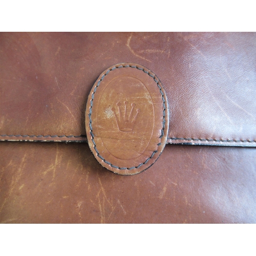 46 - Mid tan leather document case bearing a Rolex logo, together with a Cartier spectacle case