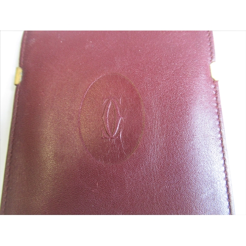 46 - Mid tan leather document case bearing a Rolex logo, together with a Cartier spectacle case